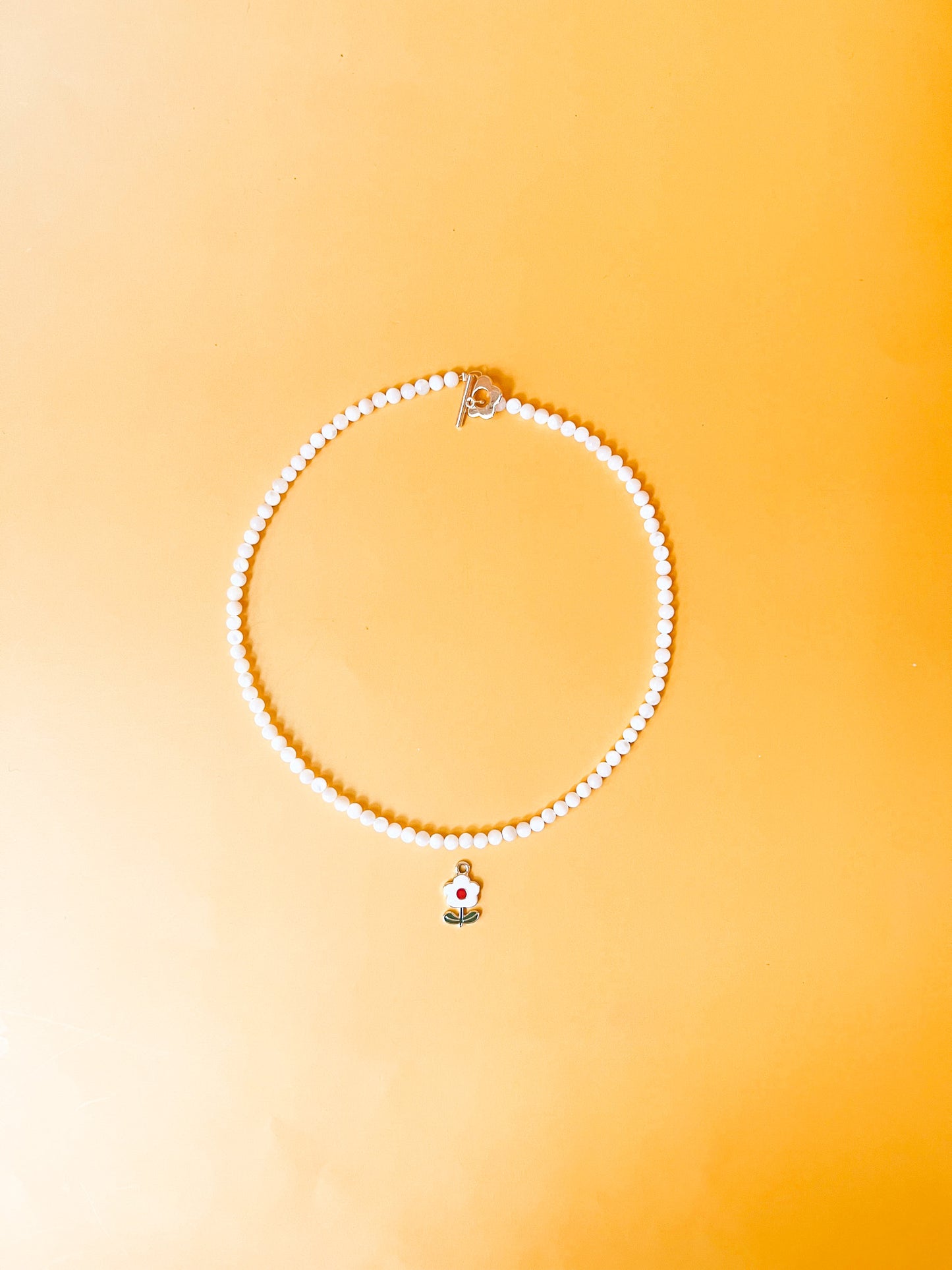 White and Red Flower Charm